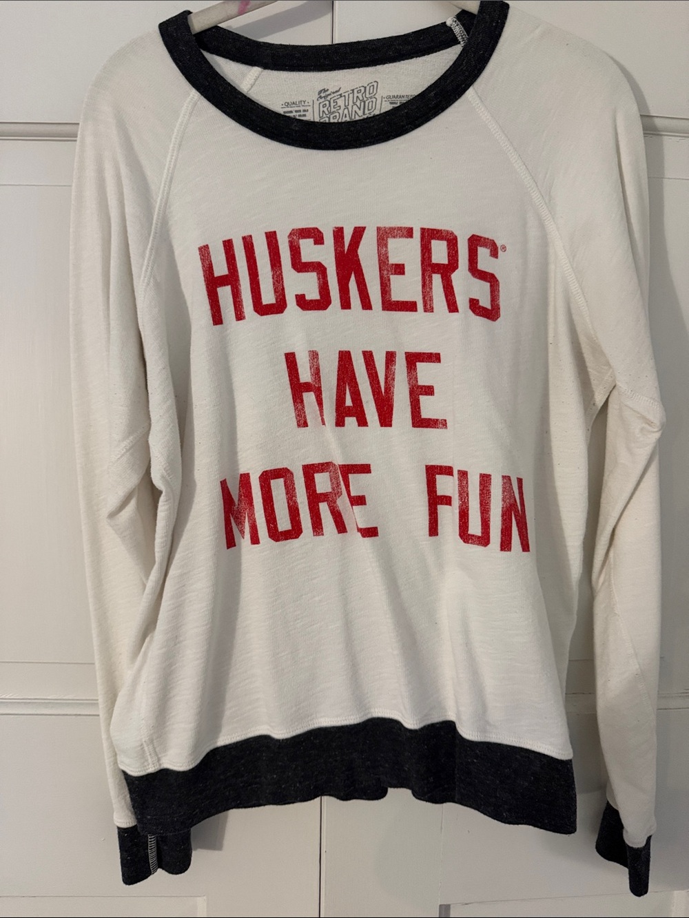 Original Retro Brand White Crewneck Sweater with Red Graphic and Black Trim